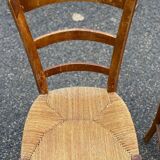 2 solid wood and straw dining chairs
