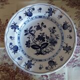 Old plates with blue floral decoration.