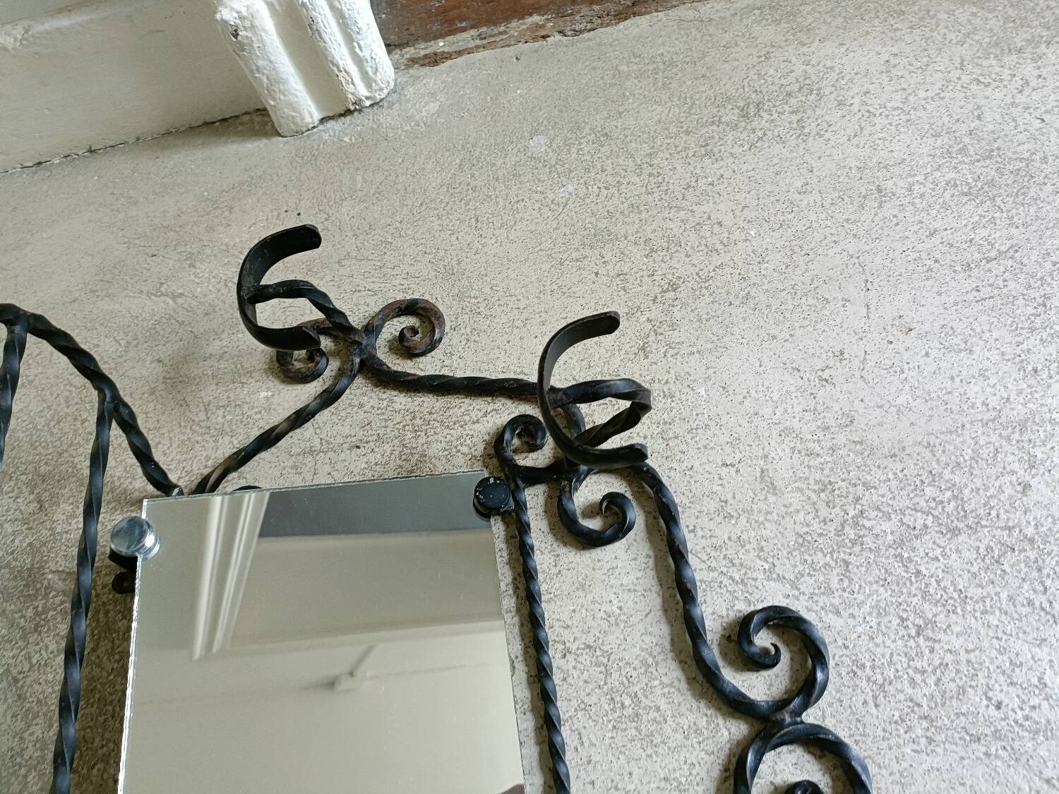 Twisted wrought iron wall-mounted coat rack
