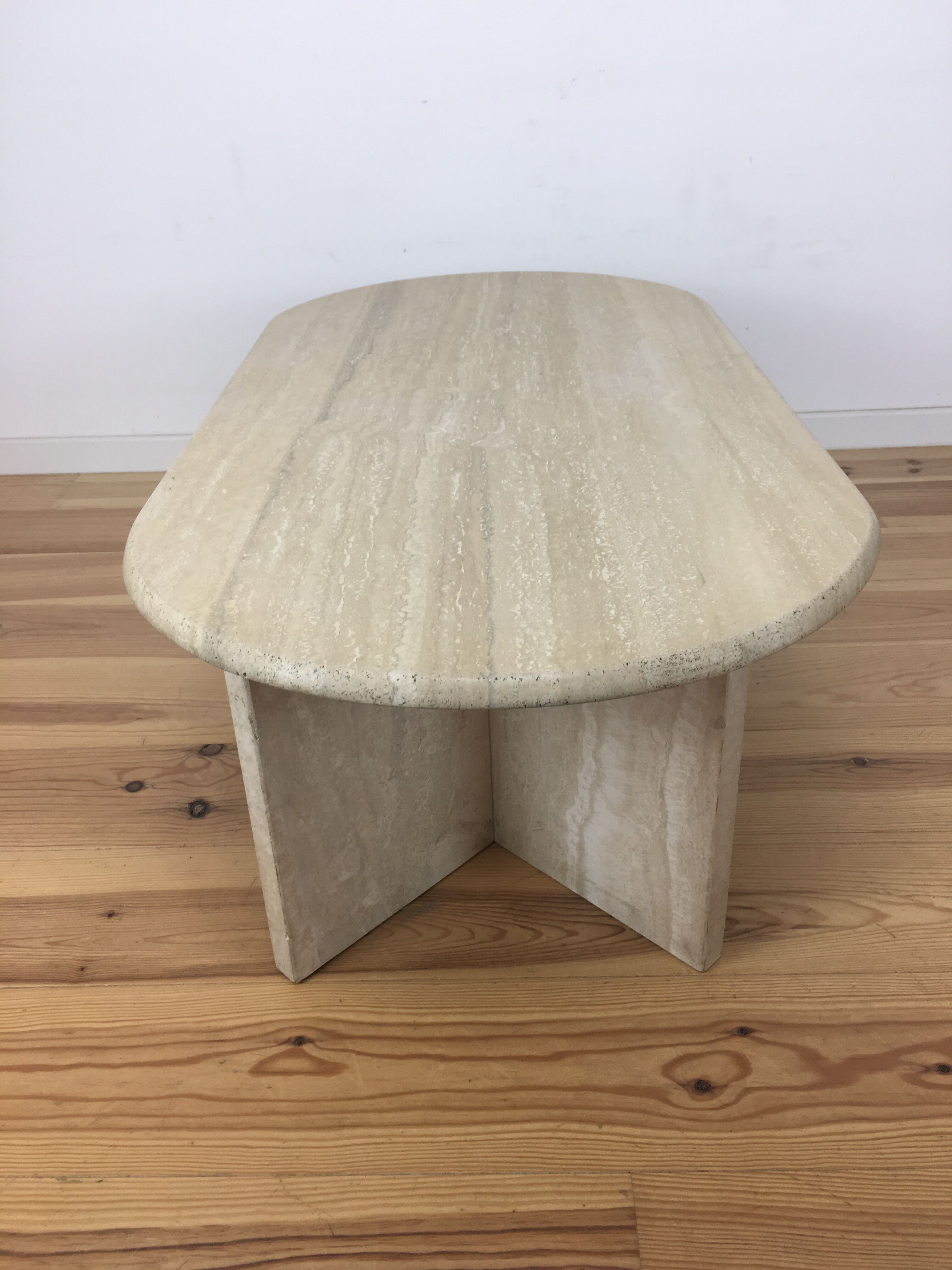 Oval coffee table in travertine