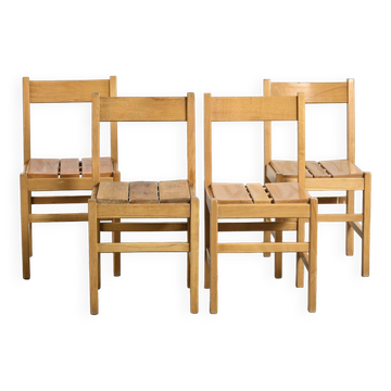 Set of four chairs in the style of Maison Regain.
