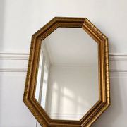 Miroir octogonal doré aux reflets cuivré