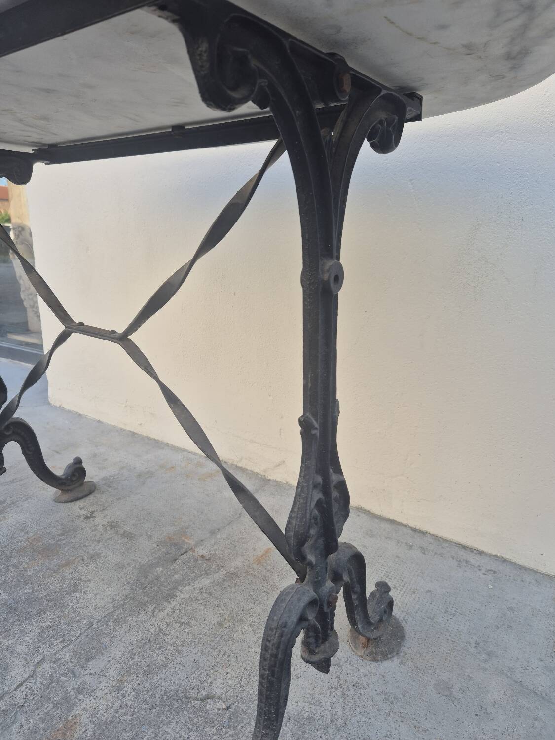 Antique cast iron and marble bistro restaurant table