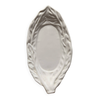 Antique leaf-shaped white English slipware dish.