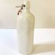 Old light gray enamelled stoneware hot water bottle