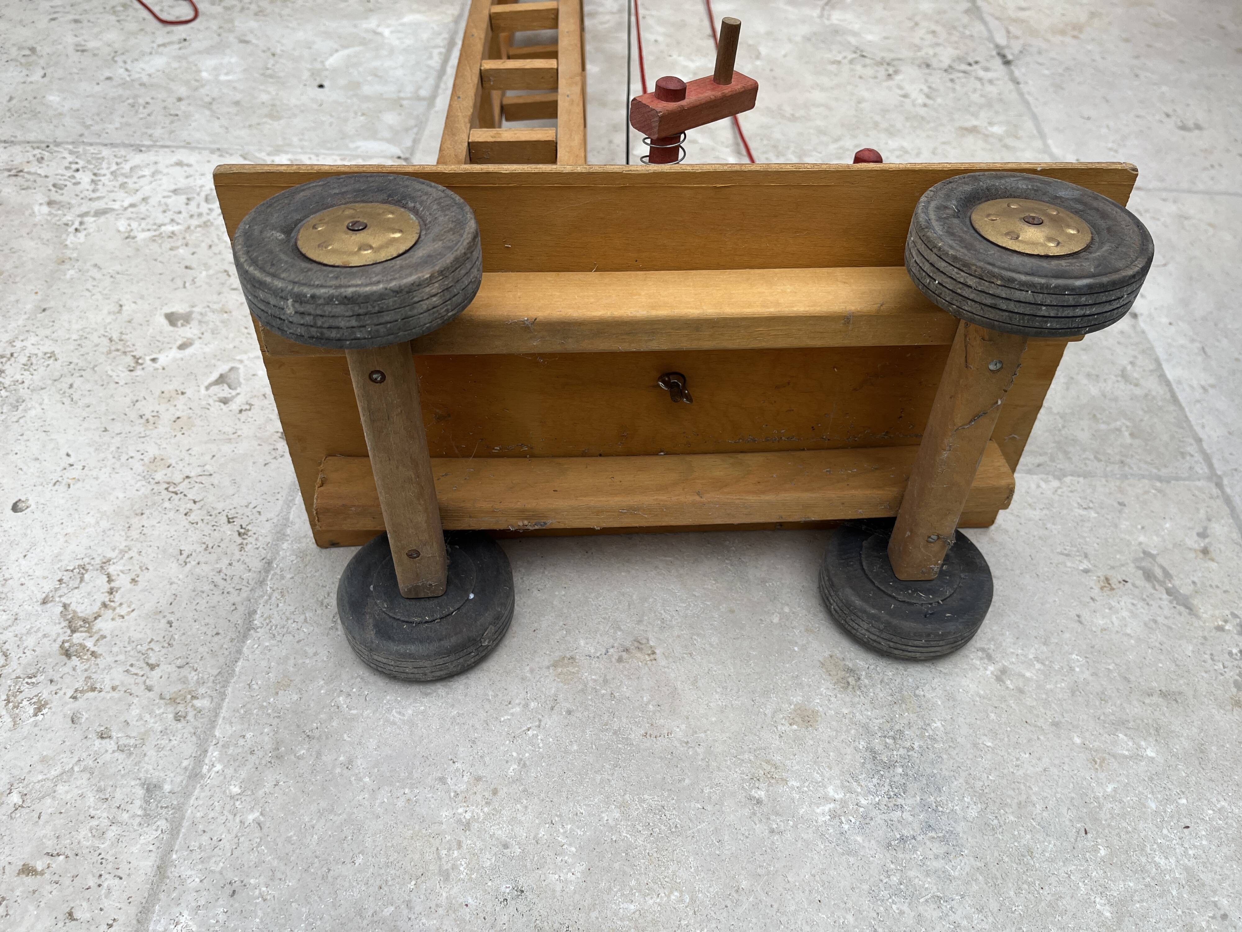 Vintage wooden crane toy from the 60s