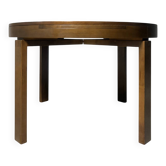 round brutalist extendable dining table from the 60s/70s