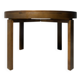 round brutalist extendable dining table from the 60s/70s