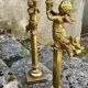 Pair of large candlesticks with cherubs