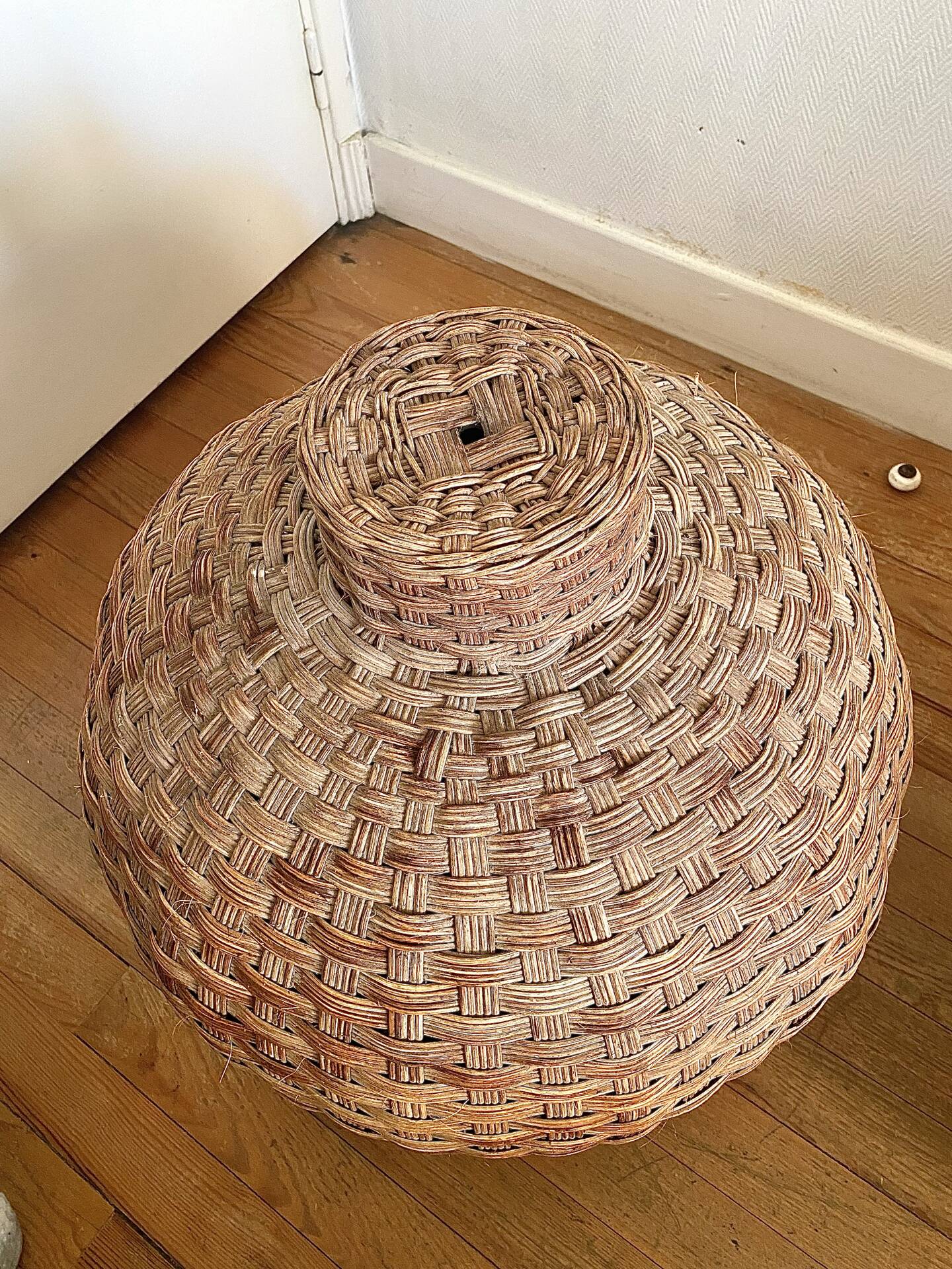 Large vintage lampshade made of hand-woven rattan.