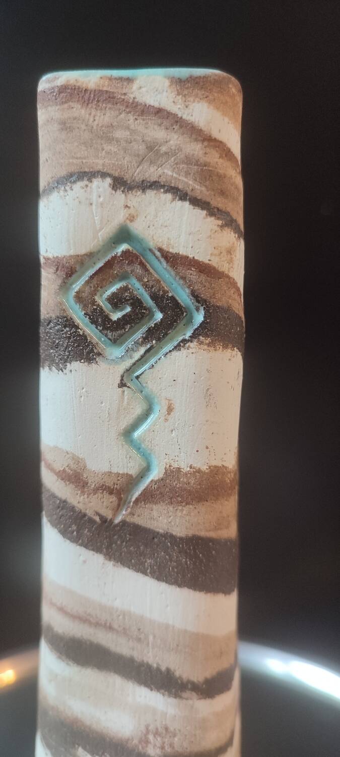 Turned stoneware vase signed with relief decoration.
