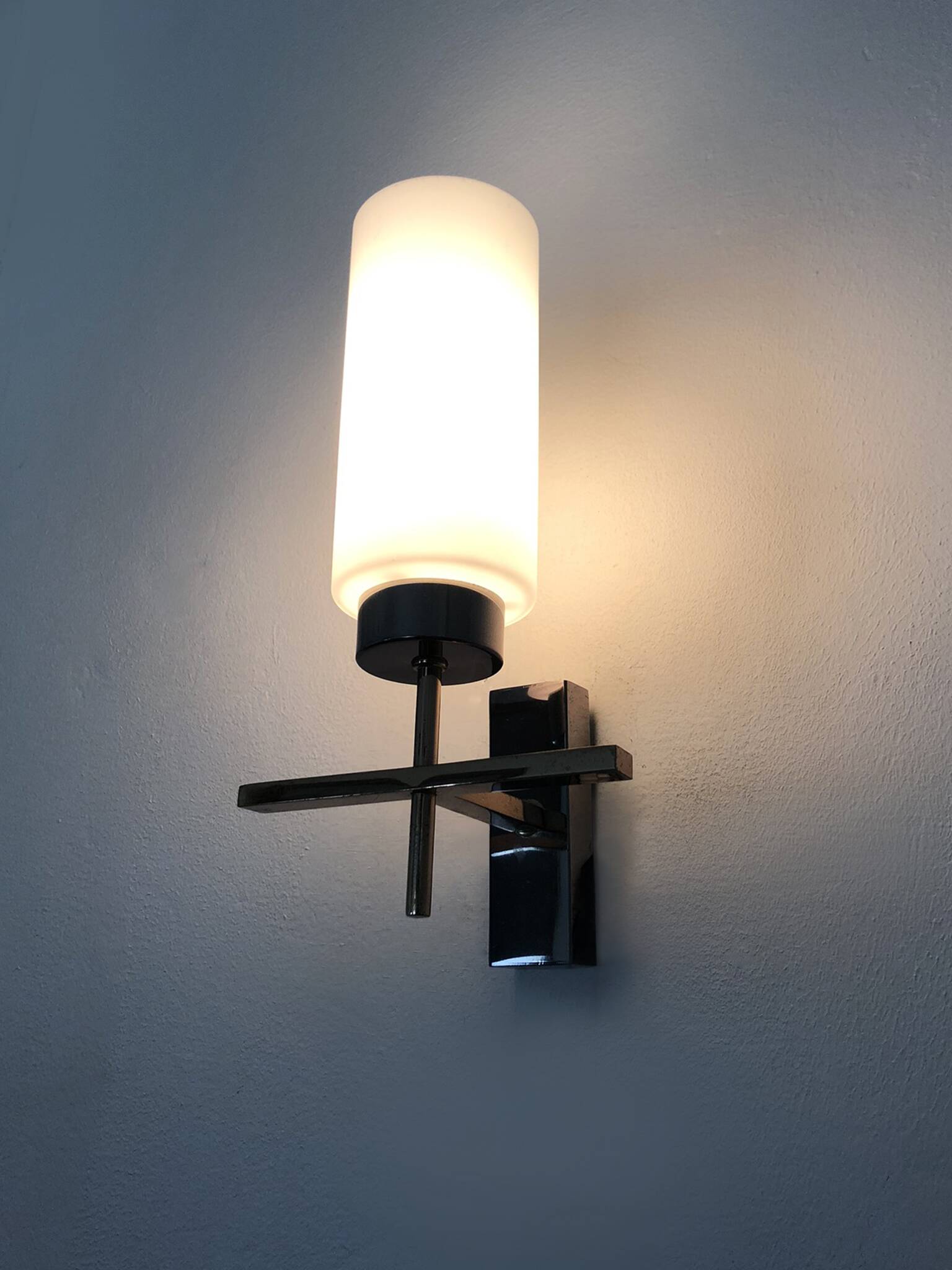 Pair of chrome-plated metal and opaline brass wall lights. 1960s