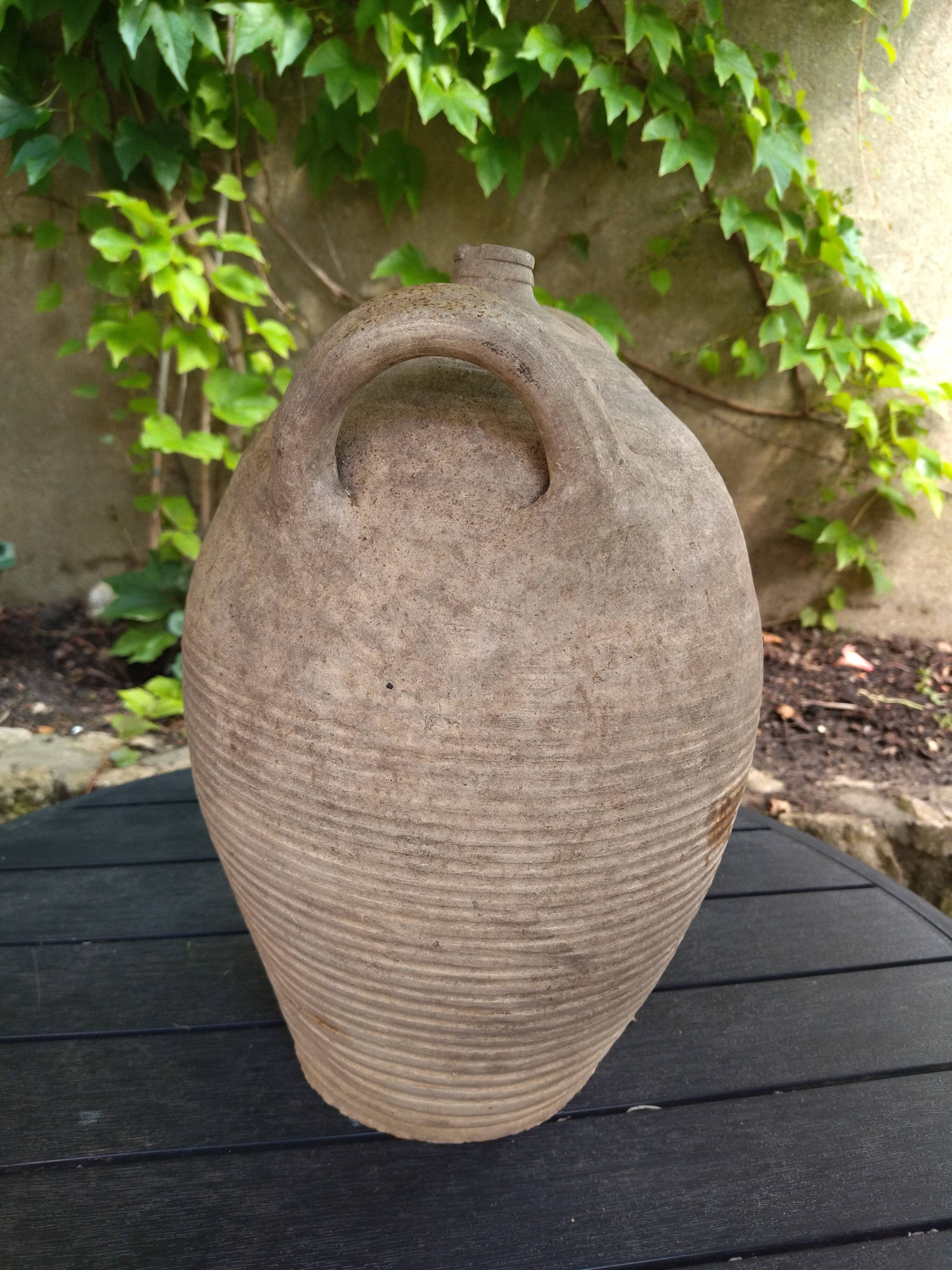 Ancient sandstone jar with two handles