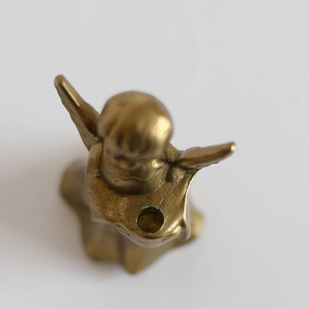 Brass cherub candle holder