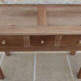 Console in solid walnut with a natural finish, featuring three drawers with a belt.