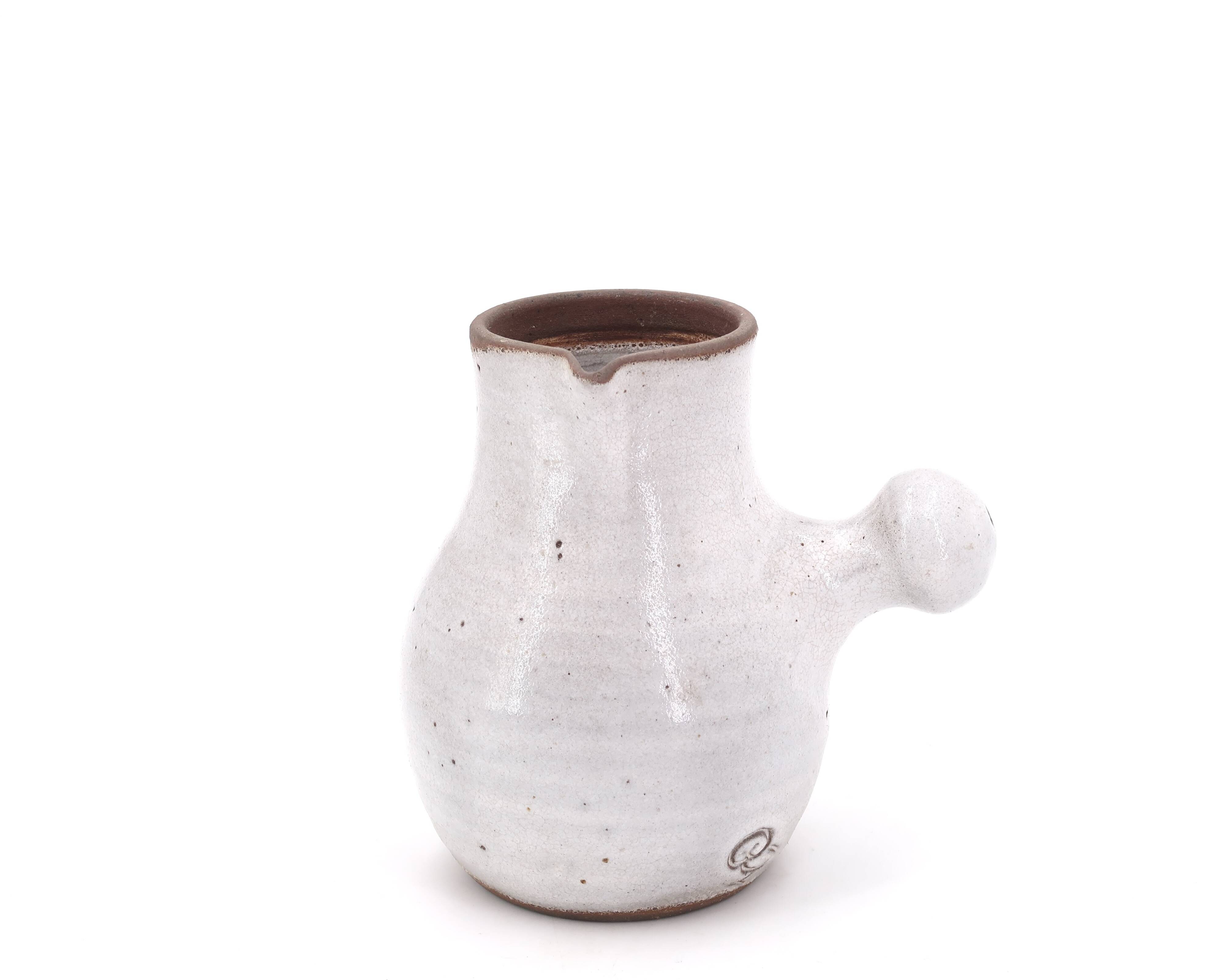 Minimalist white ceramic pitcher signed Pierlot, 1960s