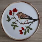 Cake display on pedestal with bird decor