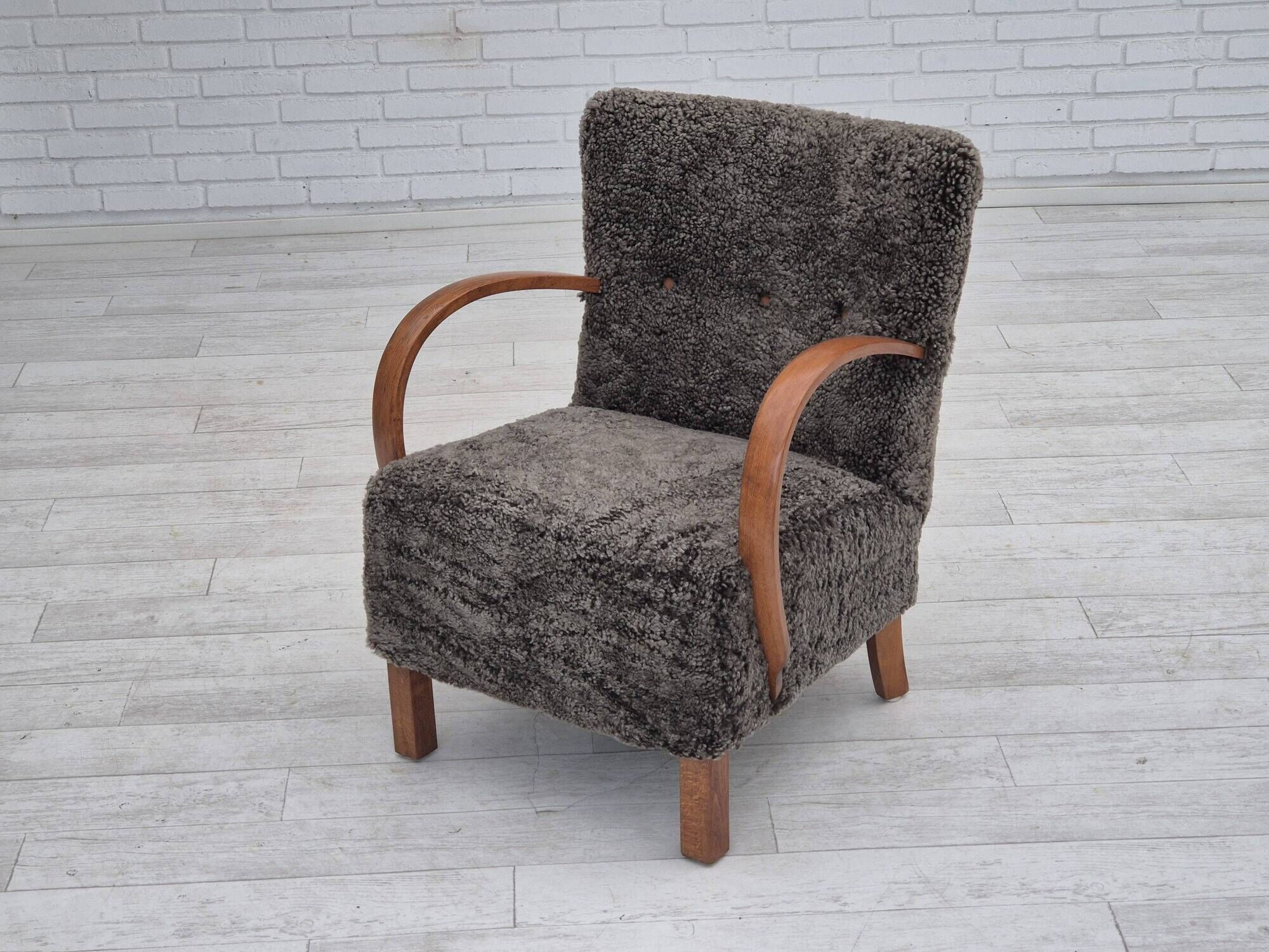 1960s, completely reupholstered Danish art deco armchair, genuine sheepskin "Wellington".