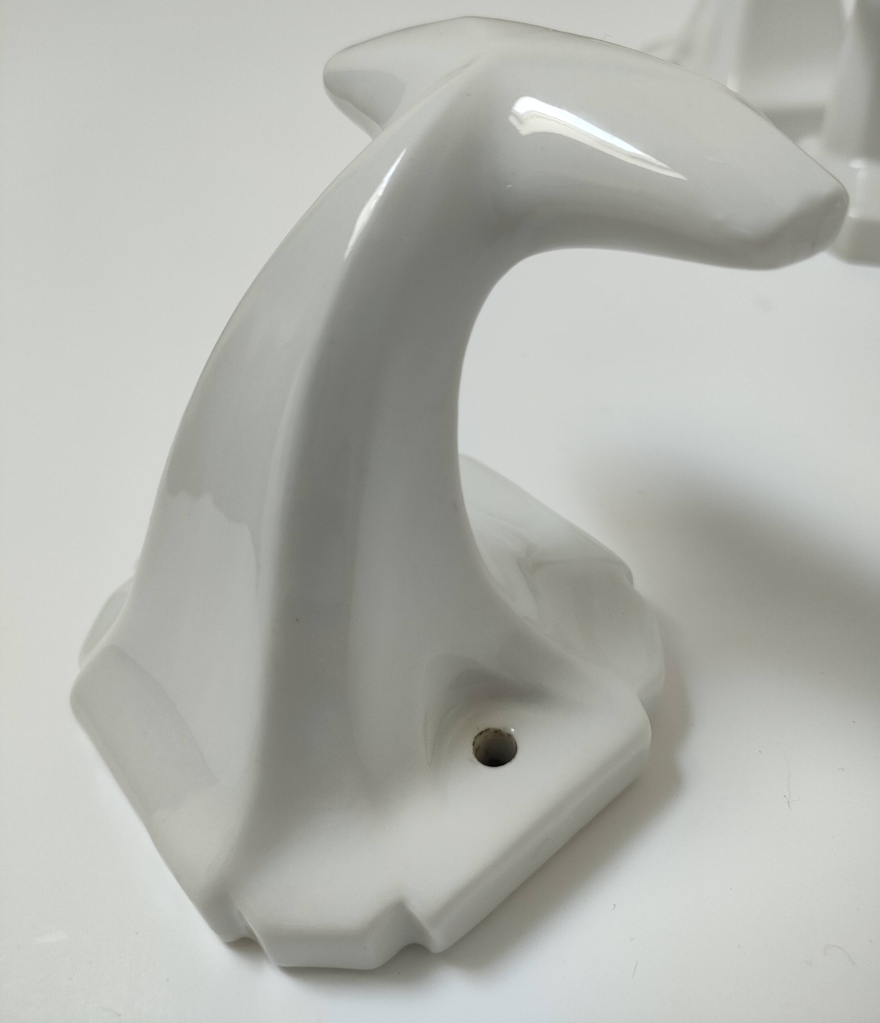 Five art deco white porcelain hooks