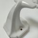 Five art deco white porcelain hooks