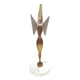 Brass decorative paperweight with a marble pedestal representing the goddess nike