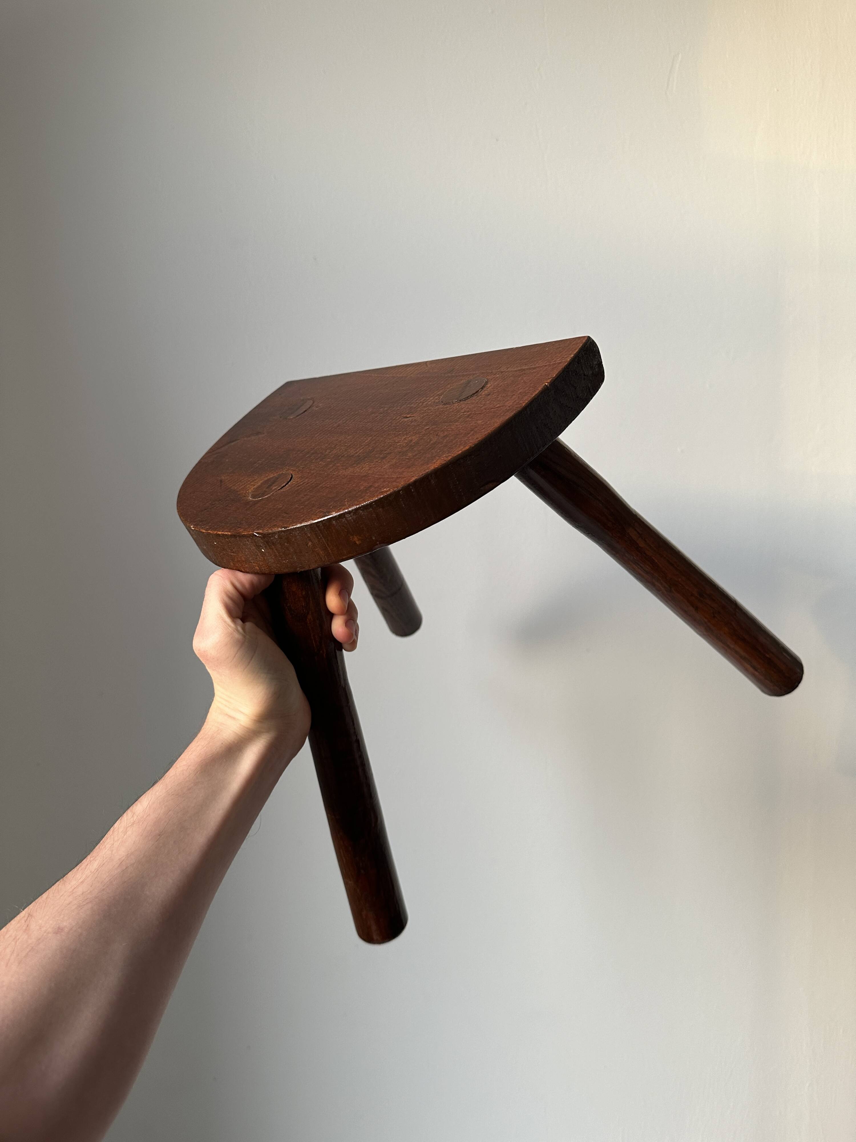 Varnished wooden stool with three legs