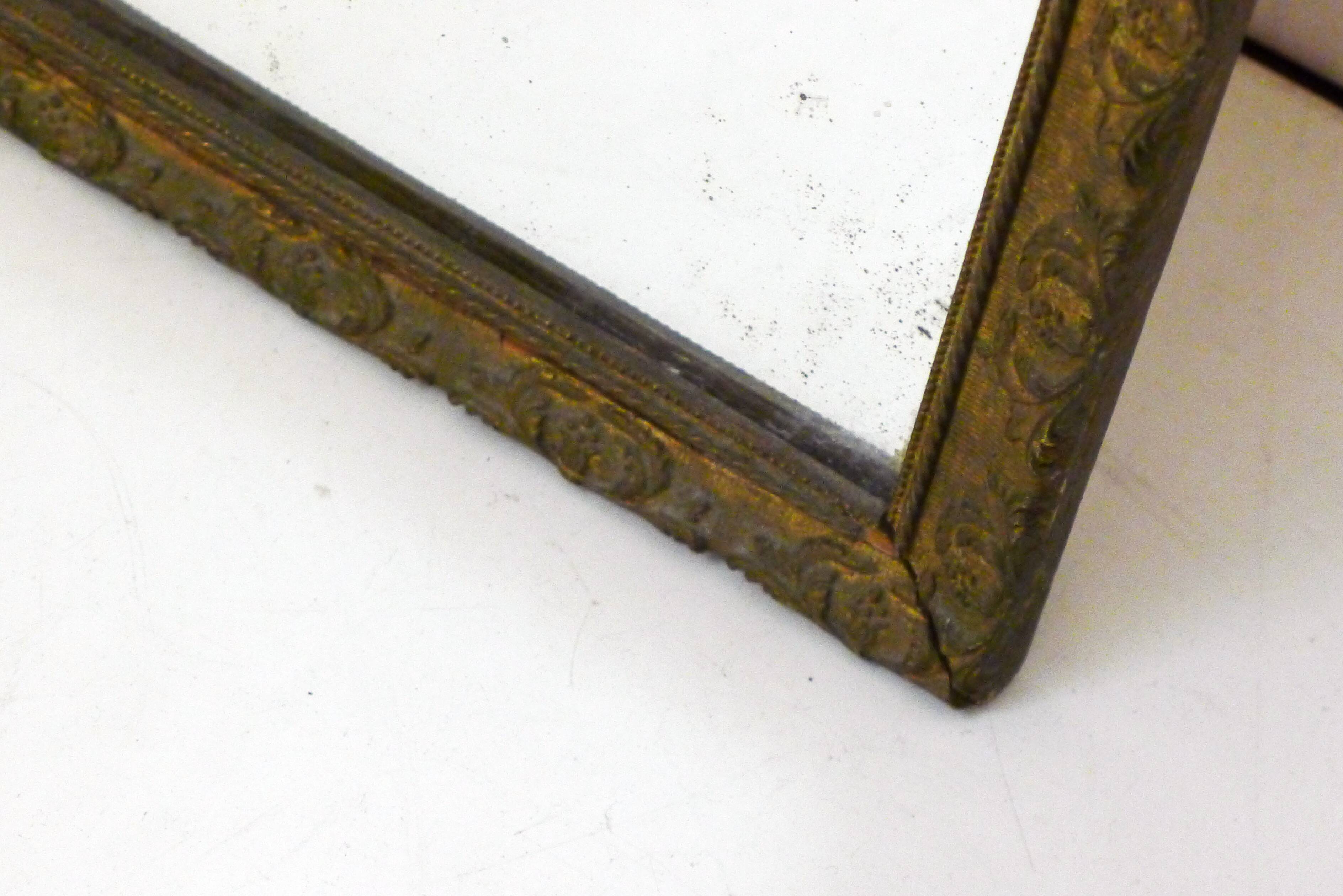 Large elongated gilded mirror