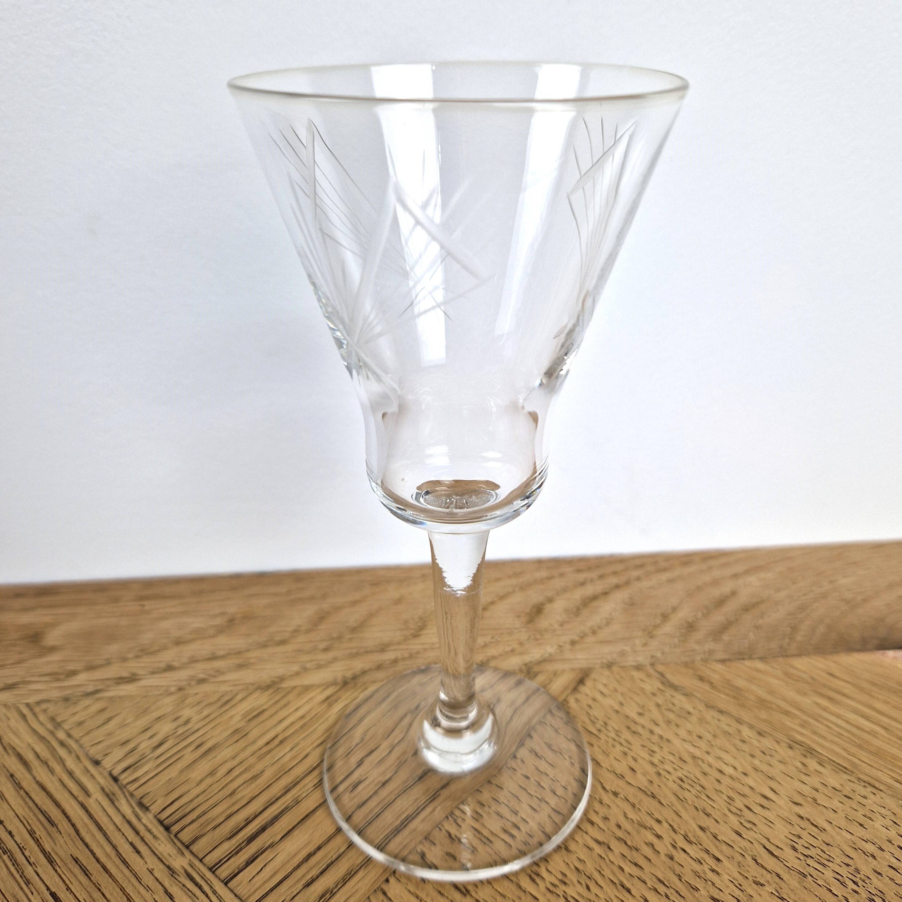 7 crystal footed glasses, antique white wine glasses.