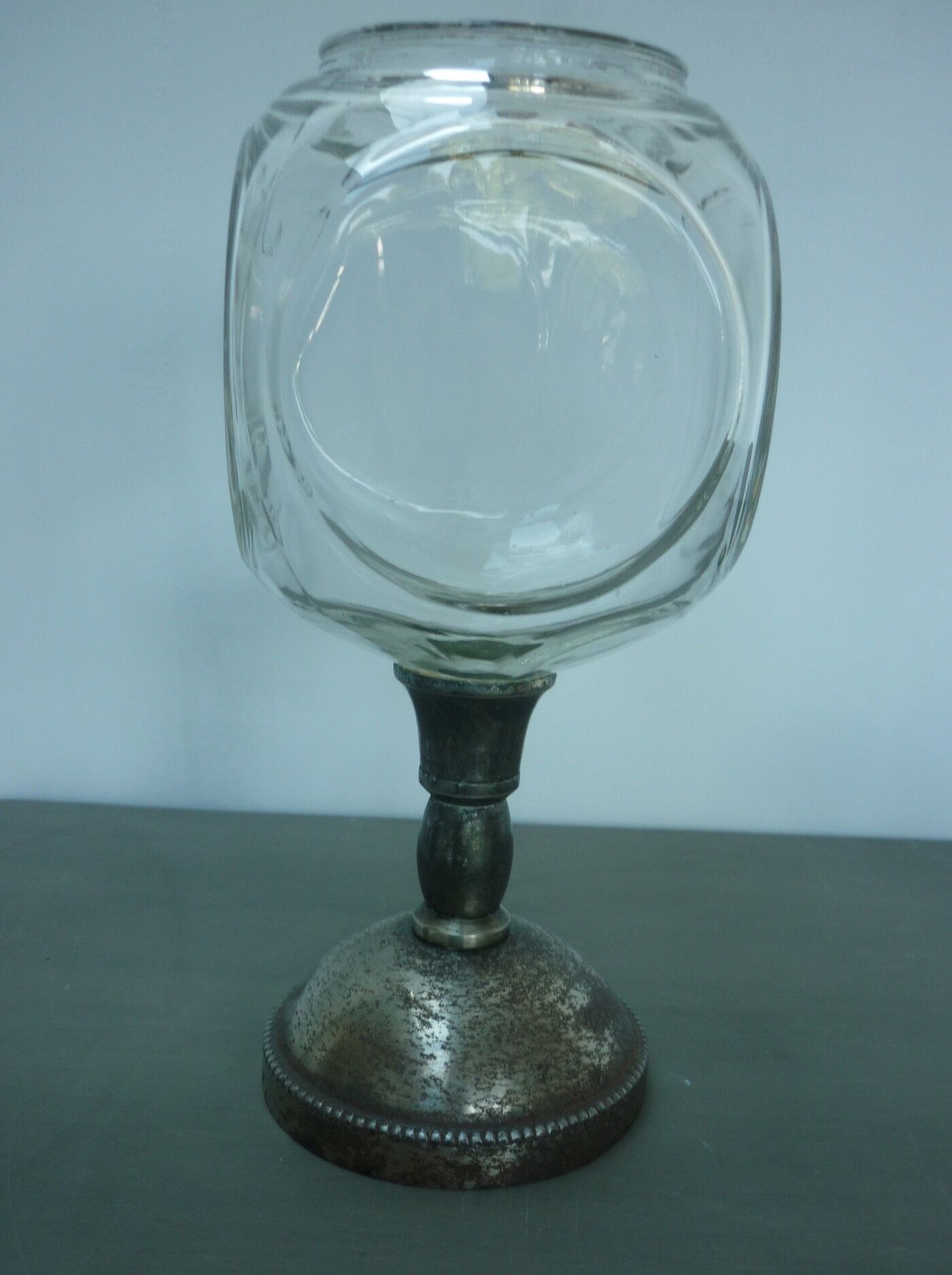 Vase or glass cup on silver stand