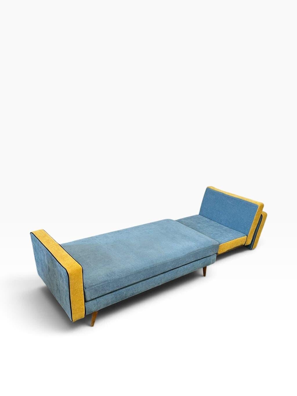 Vintage blue armchair/daybed/sofa bed with yellow accents.