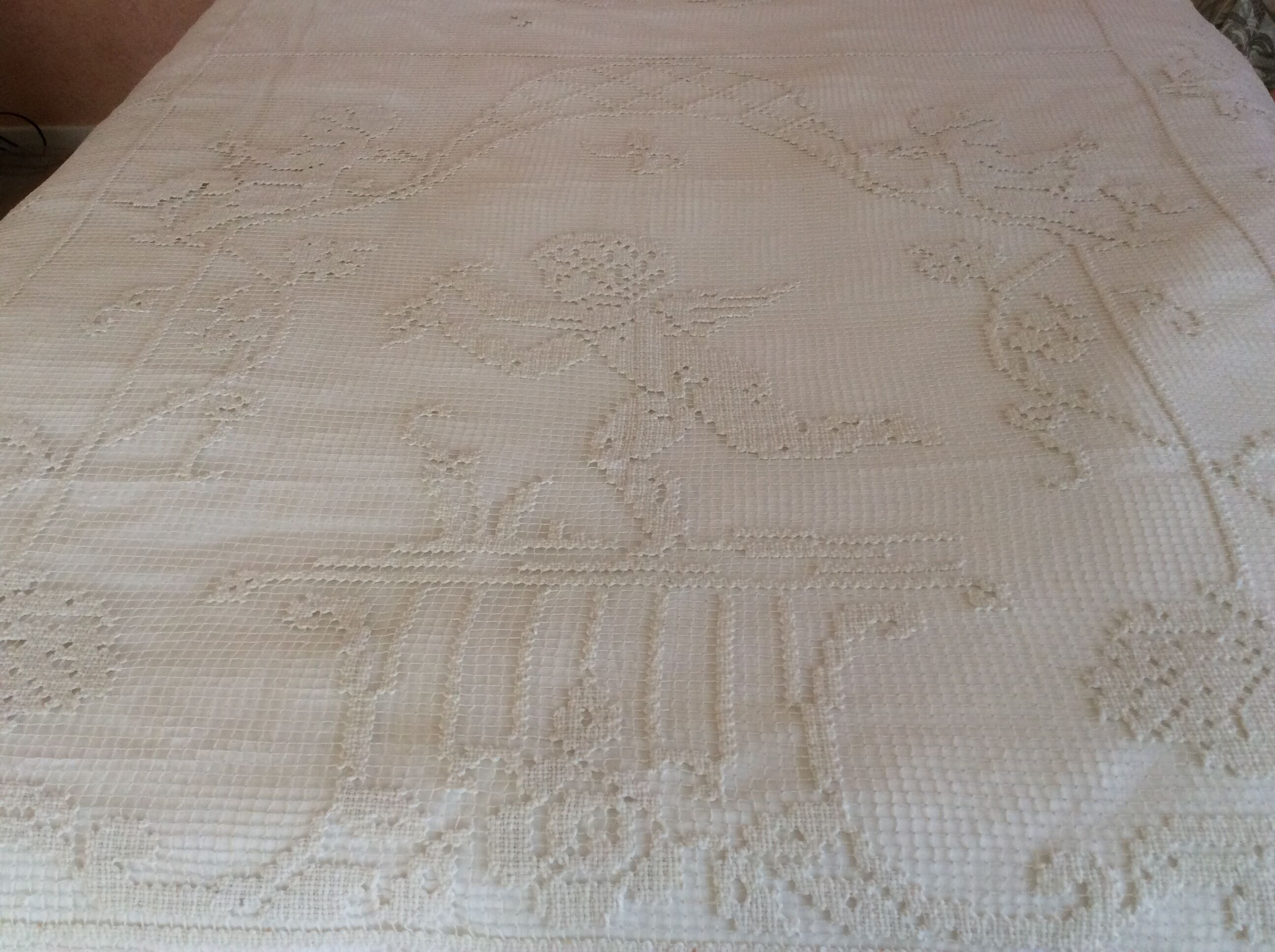 Old bedspread with angel embroidery
