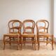 Set of 6 traditional wooden chairs with woven straw.