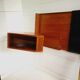 Mid century 1970s retro teak headboard with two hinged bedsides, upholstered in black by 'slumberlan