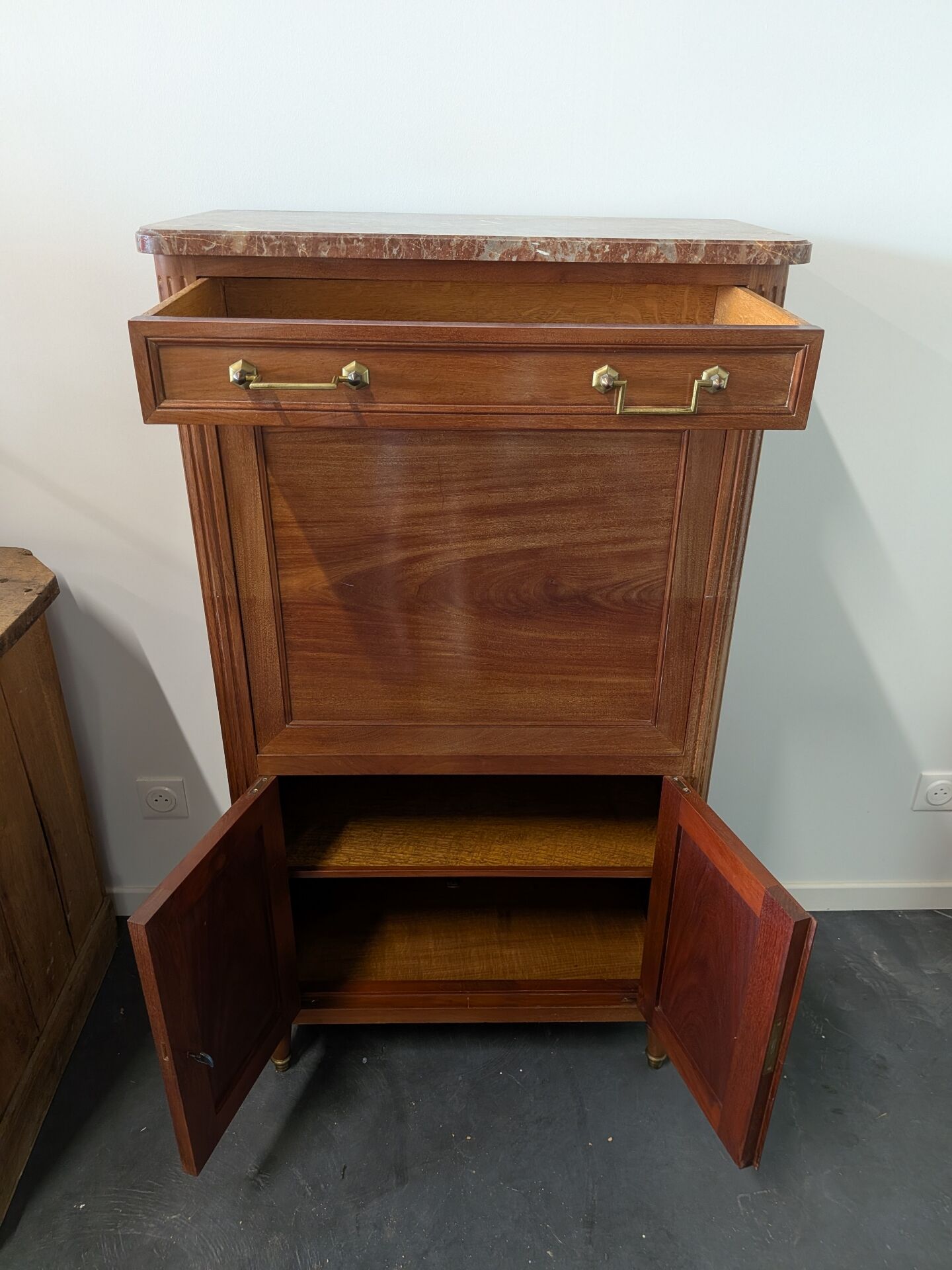 Secretary with a drop-leaf in Louis XVI style made of mahogany and royal red marble.