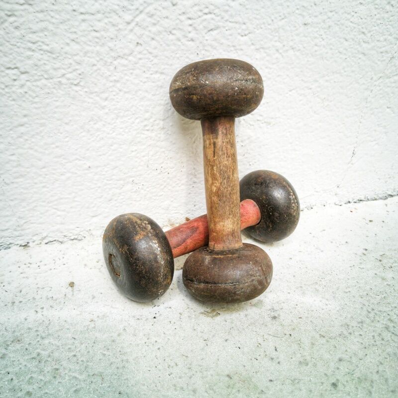 Pair of vintage dumbbells in cast iron and wood