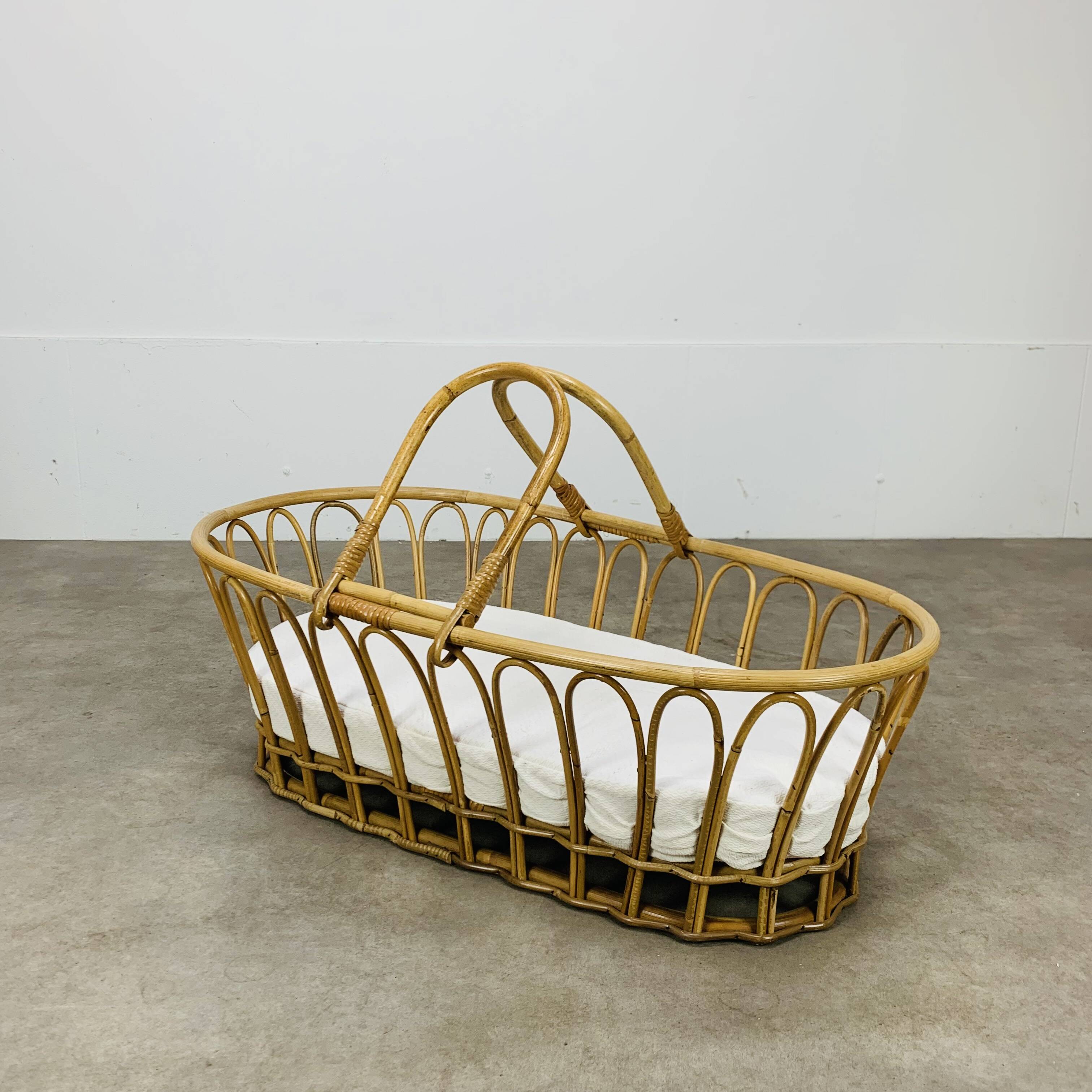 Vintage rattan baby bassinet