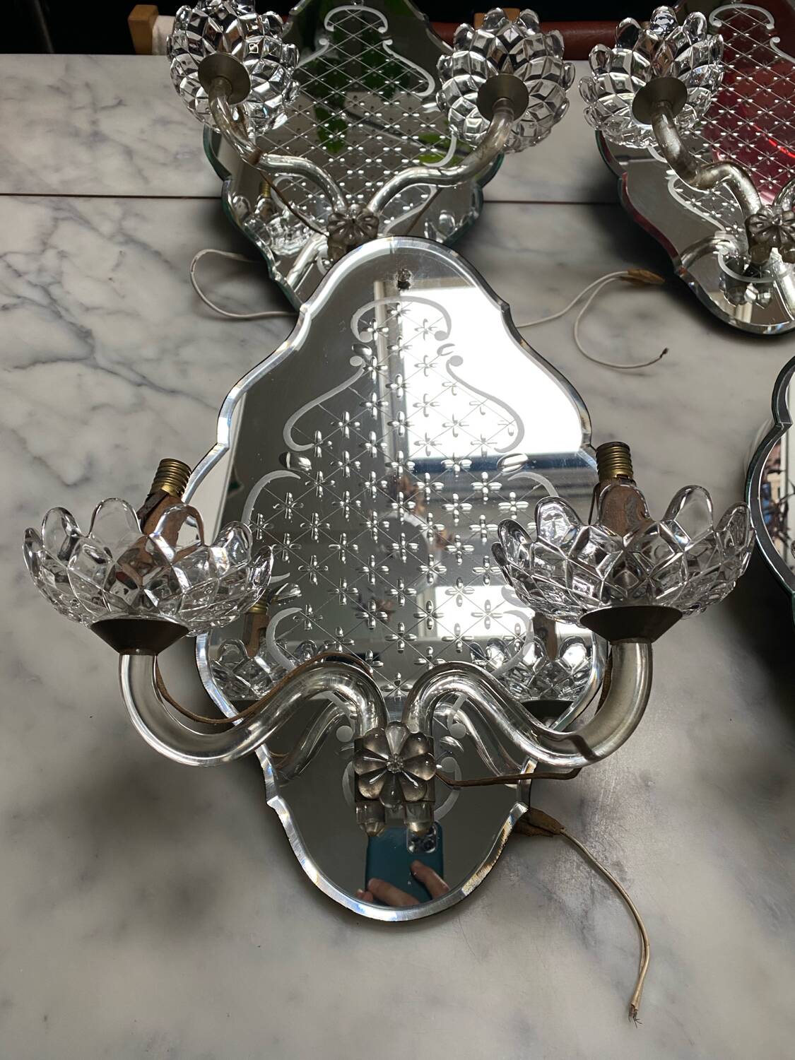 Venetian wall lights with Baccarat crystal mirror.