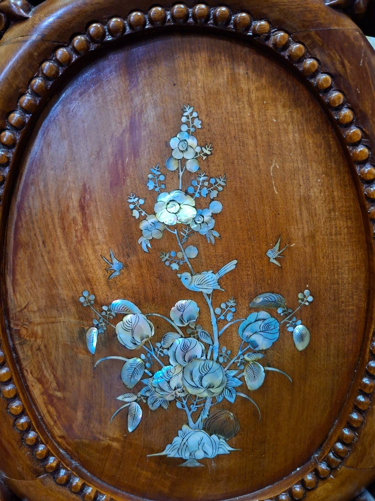 Pair of Asian armchairs in carved wood with mother-of-pearl inlays.