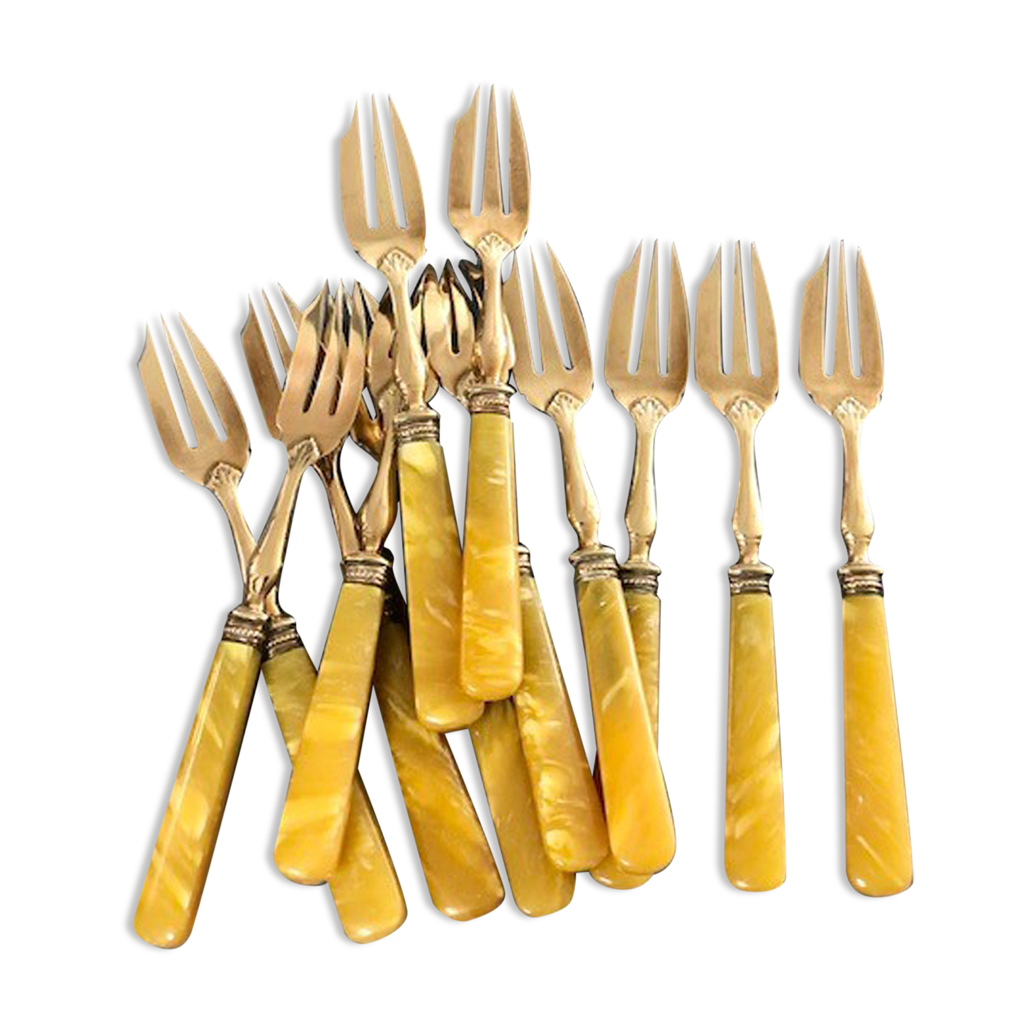 Brass and yellow galathite cake forks