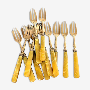 Brass and yellow galathite cake forks