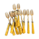 Brass and yellow galathite cake forks