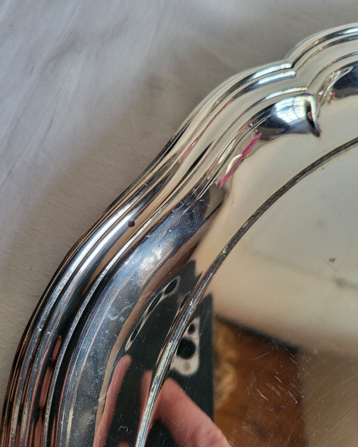 Round silver-plated serving dish with a glass base.