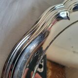 Round silver-plated serving dish with a glass base.