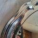 Round silver-plated serving dish with a glass base.
