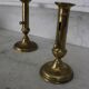Pair of brass pusher candlesticks