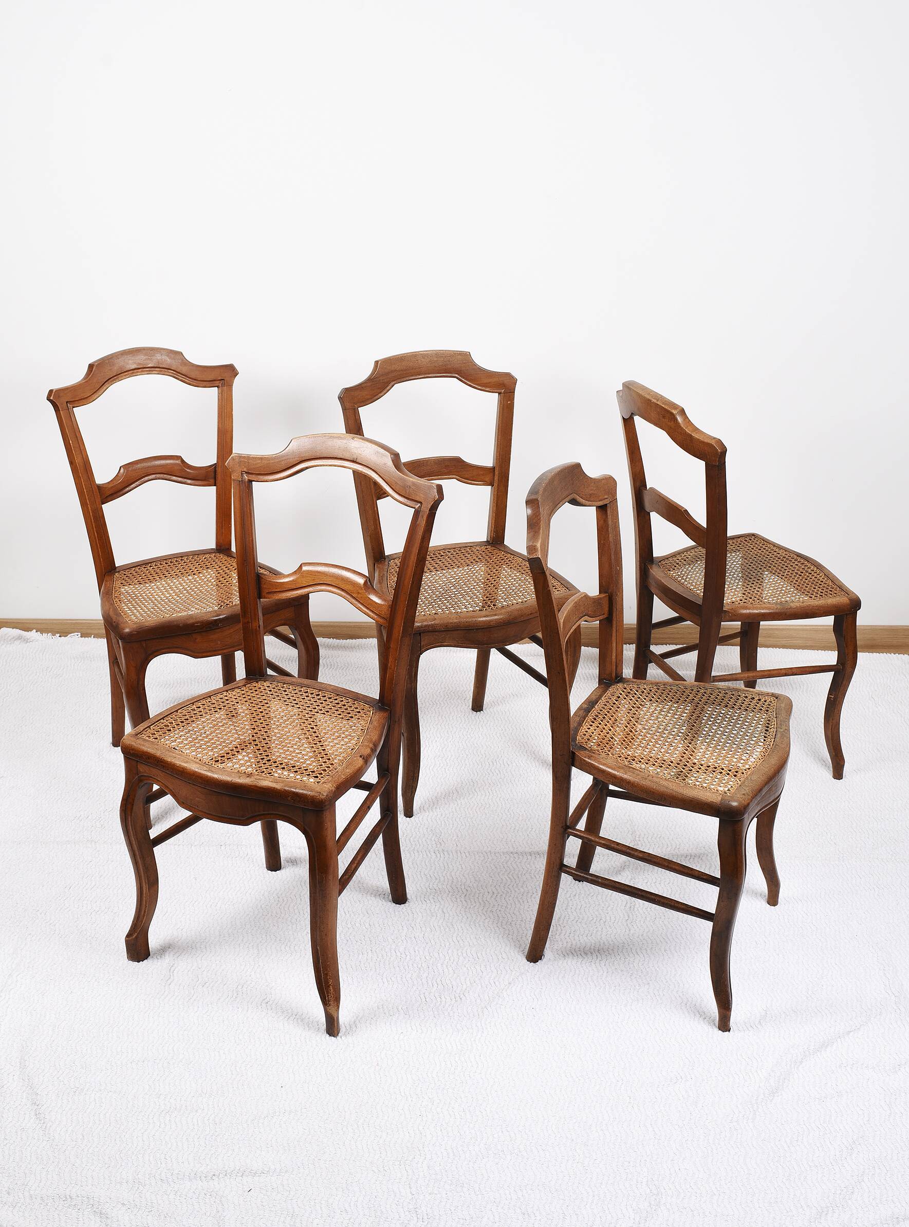 Set of 5 old cane chairs.