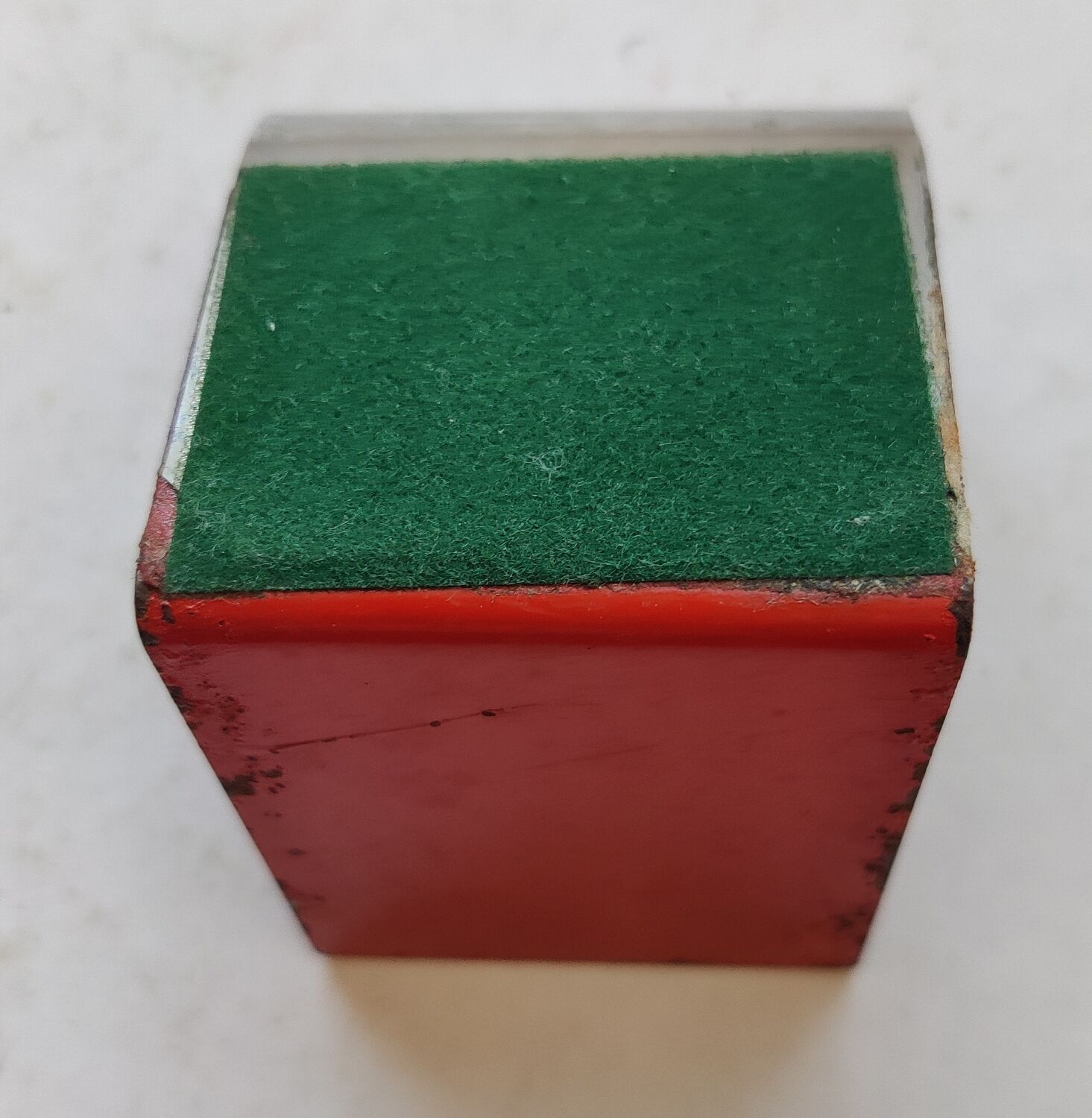 Modernist extendable bookends in brushed stainless steel and red 1970's