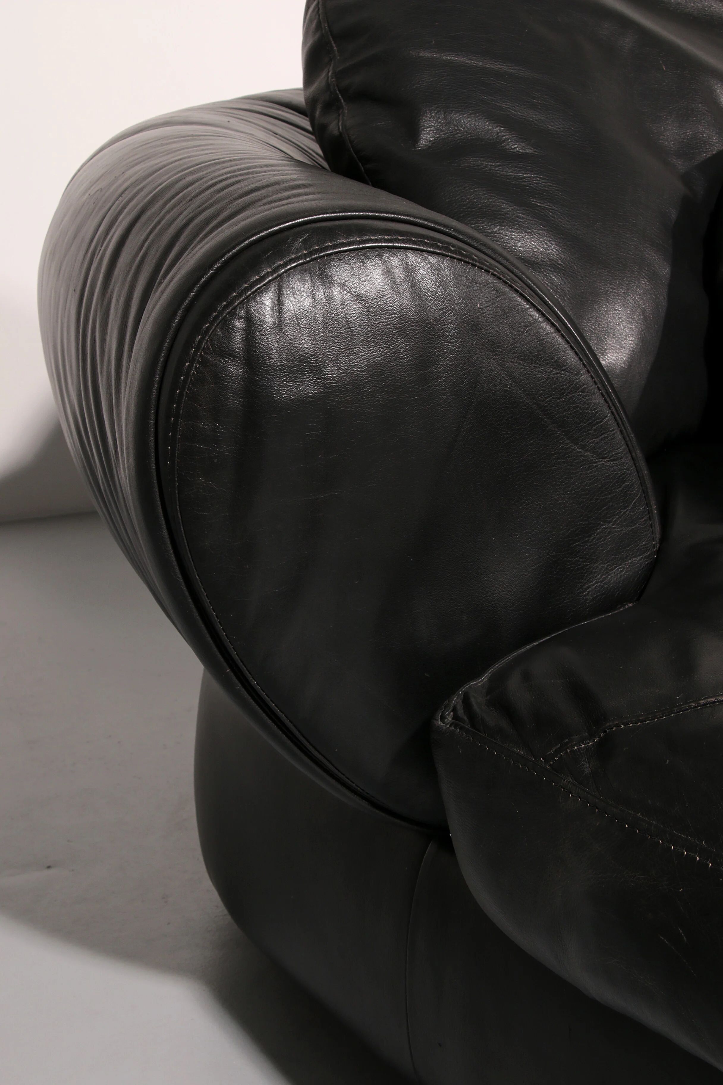 Organically shaped post-modern sectional sofa in black leather
