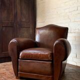 French leather club chair, chapeau de gendarme model, circa 1940