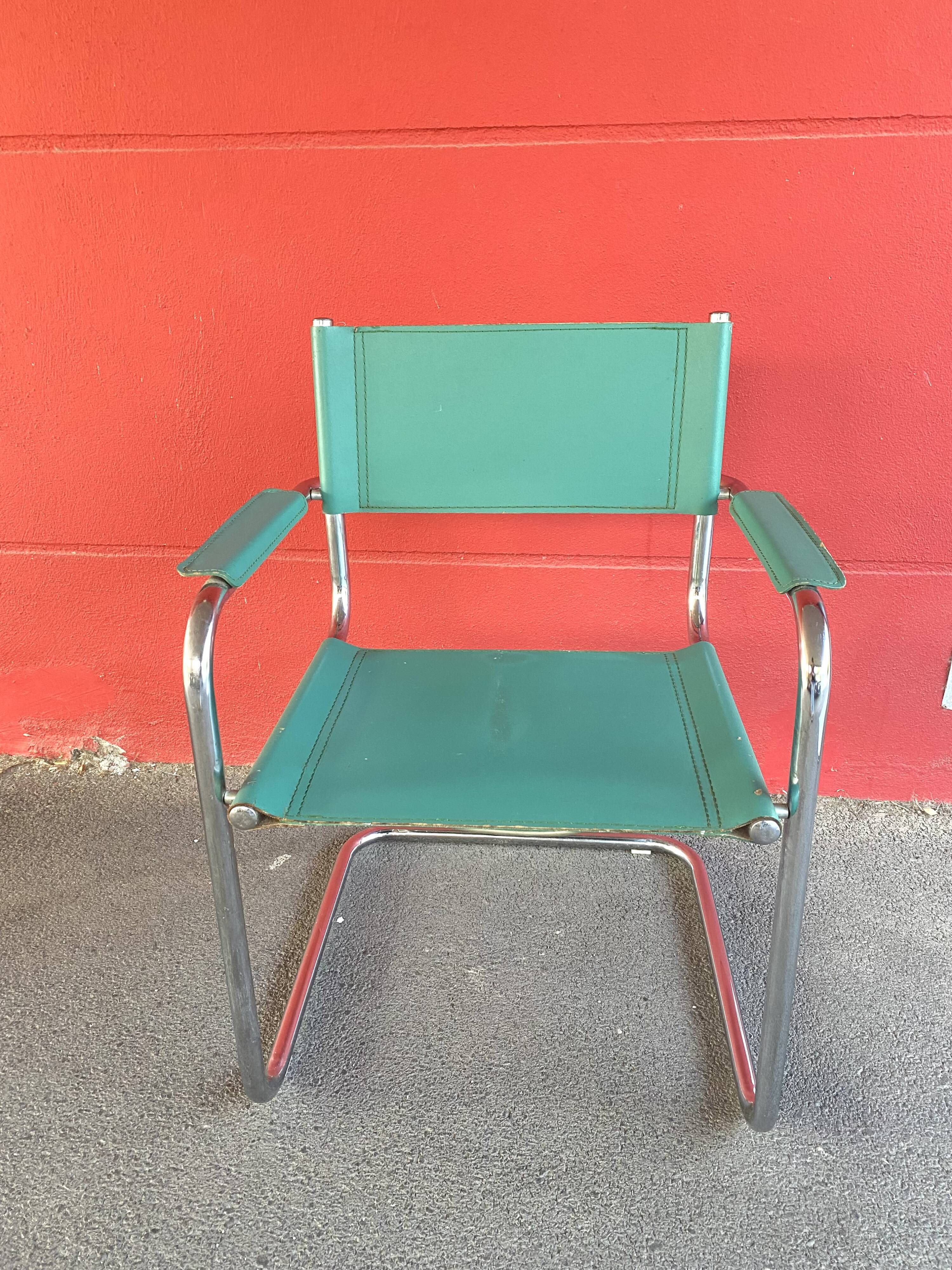 Pair of faux leather and chrome armchairs